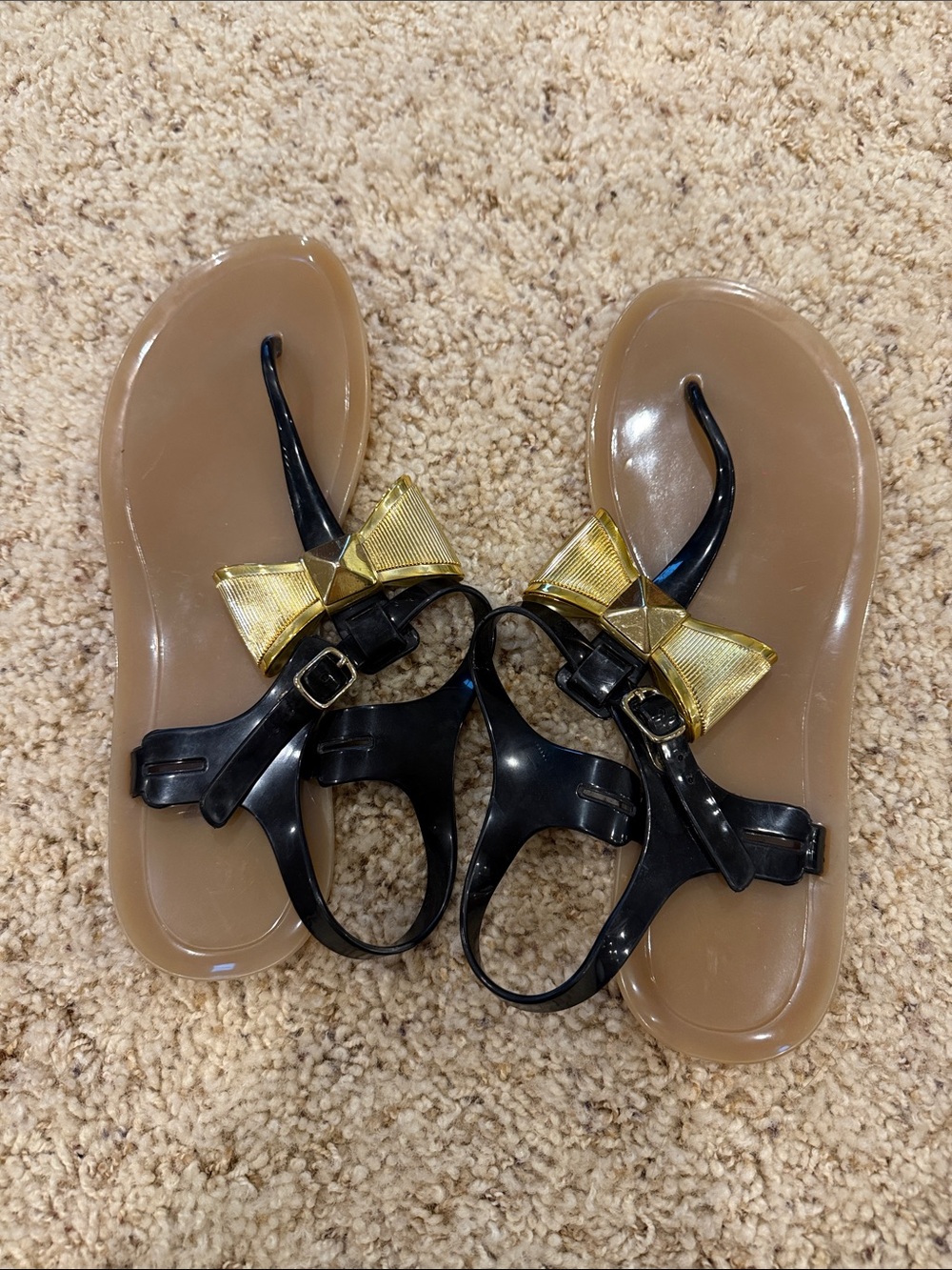 Kate Spade Women’s Black Jelly Sandals with Gold Bow Accent